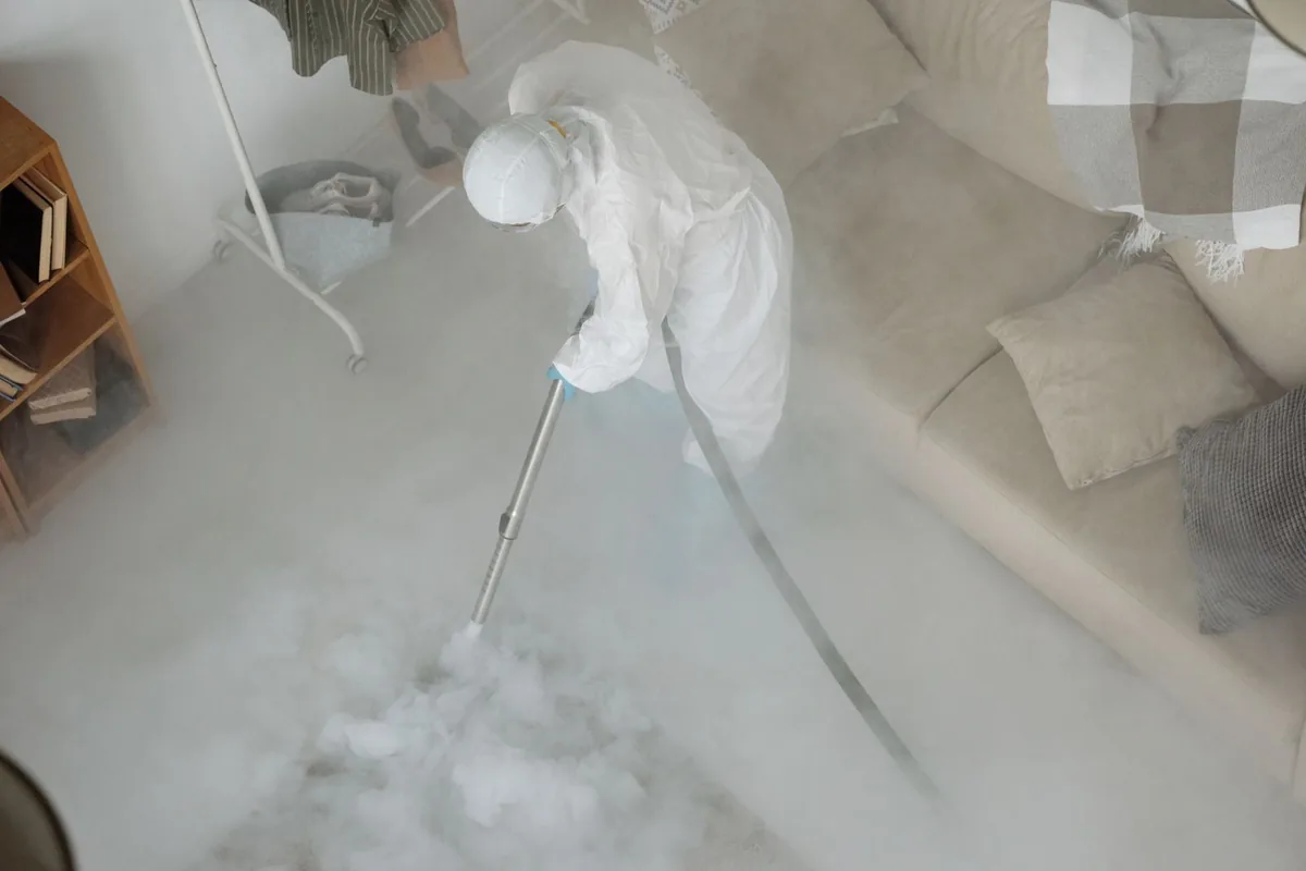 Biohazard cleanup technician in protective equipment, Bracey, VA